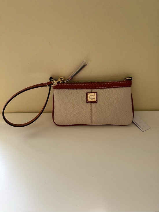 Dooney & Bourke Handbags - Brand New Dooney & Bourke Leather Large Slim Wristlet in Bone with Tan Trim.